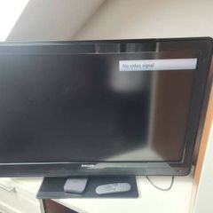 42 inch Philips tv with stand, sky puck and sky remote.