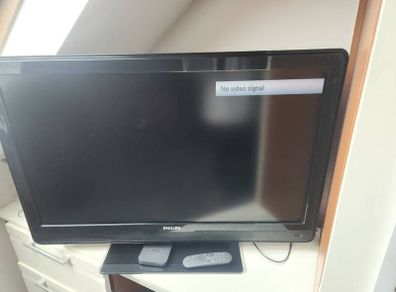 42 inch Philips tv with stand, sky puck and sky remote.