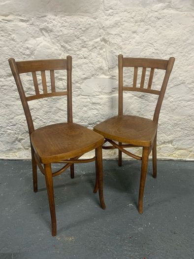 A pair of tall Thonet bentwood chairs.