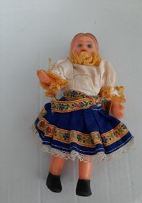 Small vintage rubber doll in costume