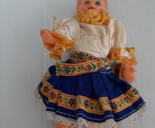 Small vintage rubber doll in costume