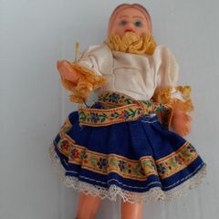 Small vintage rubber doll in costume