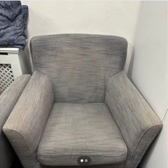 Two grey fabric armchairs