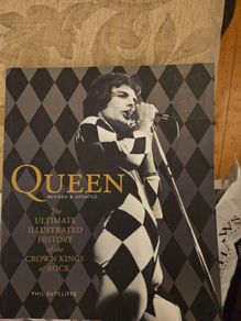 Queen. The Ultimate Illustrated History Of The Crown Kings Of Rock. By Phil Sutcliffe. First Edition Large Volume Paperback In Good Condition.  See Photos For Same.