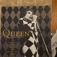 Queen. The Ultimate Illustrated History Of The Crown Kings Of Rock. By Phil Sutcliffe. First Edition Large Volume Paperback In Good Condition.  See Photos For Same.