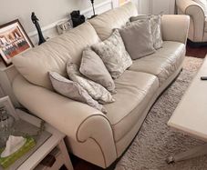 White leather couch/suite with footrests