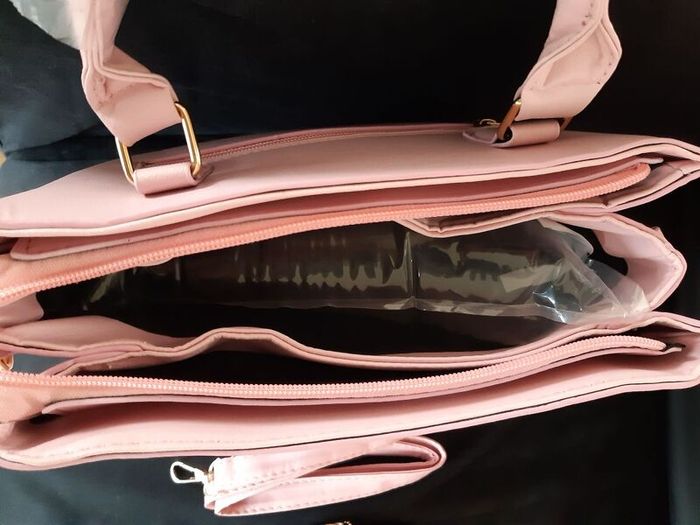 Bottle of Perfume and New Handbag