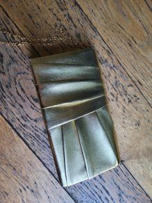 Gold color clutch bag with chain