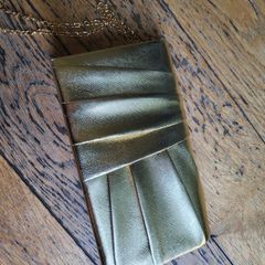 Gold color clutch bag with chain