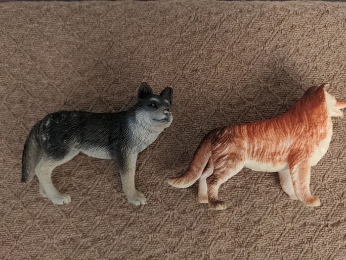 Two toy dog figures