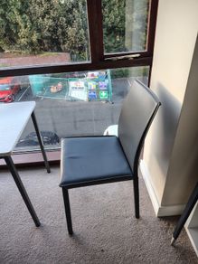 Black faux leather dining chair
