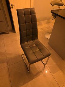 Free grey kitchen table chair damage to one side.