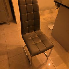 Free grey kitchen table chair damage to one side.