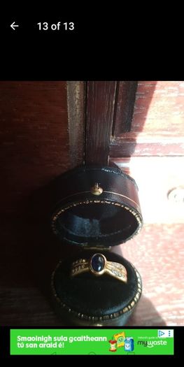 18 ct gold ring with Sapphire stone and 16 brilliant cut diamonds