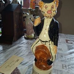 1950s to 70s Working Musical Decanter Hobo Clown Sitting on a Barrel. The base plays the tune Show Me the Way to Go Home, reminded me of the song from Jaws