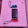 nintendo switch and 2 games Image 2