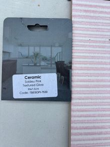 Pink ceramic and white tiles