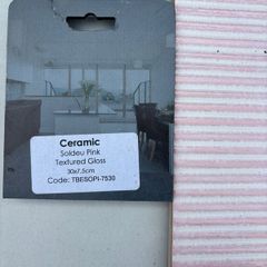 Pink ceramic and white tiles