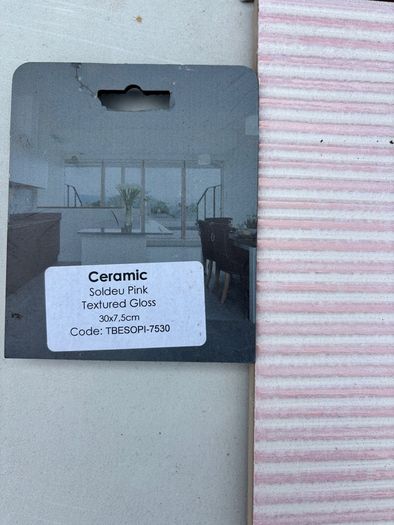 Pink ceramic and white tiles