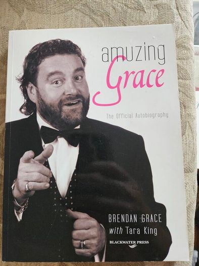 Amuzing Grace. The Official Autobiography.  By Brendan Grace With Tara King. Signed First Edition Paperback In Good Condition.  See Photos For Same.