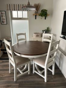 Round reclaimed wood dining table and four chairs