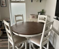Round reclaimed wood dining table and four chairs