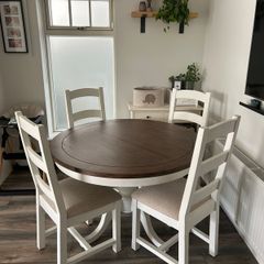 Round reclaimed wood dining table and four chairs