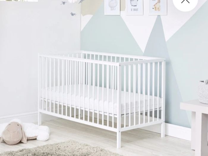 small cot with mattress