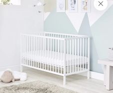 small cot with mattress