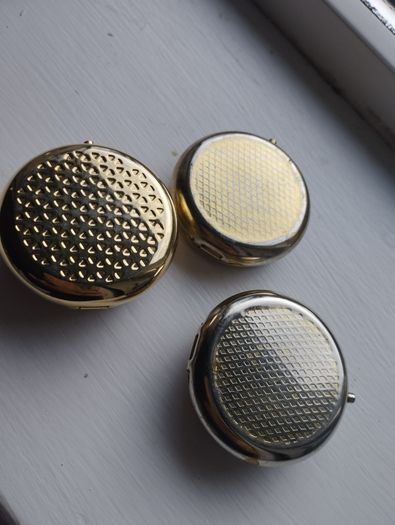 Three vintage pill boxes.