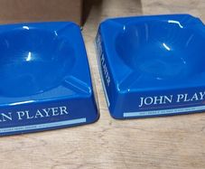 2 x large john players ashtrays 6inch square,,new old stock, brand new ,prefect condition, price includes post to anywhere in ireland thank you, by certificate proof of post,,