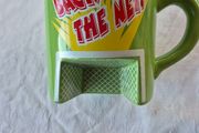A novelty flick football interactive coffee mug
