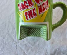 A novelty flick football interactive coffee mug