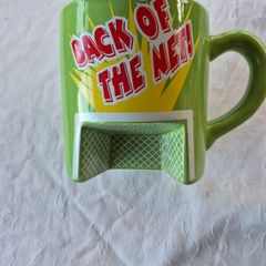 A novelty flick football interactive coffee mug
