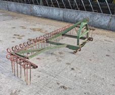 Grass harrow