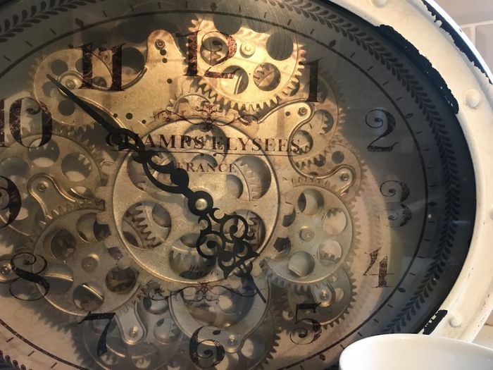 Clock with moving gears