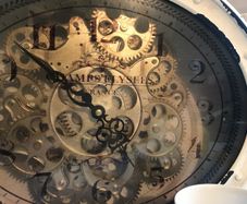 Clock with moving gears