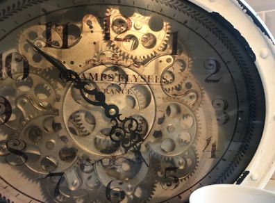 Clock with moving gears
