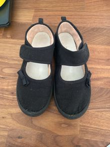 Girls black plimsoles size 12