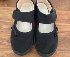 Girls black plimsoles size 12