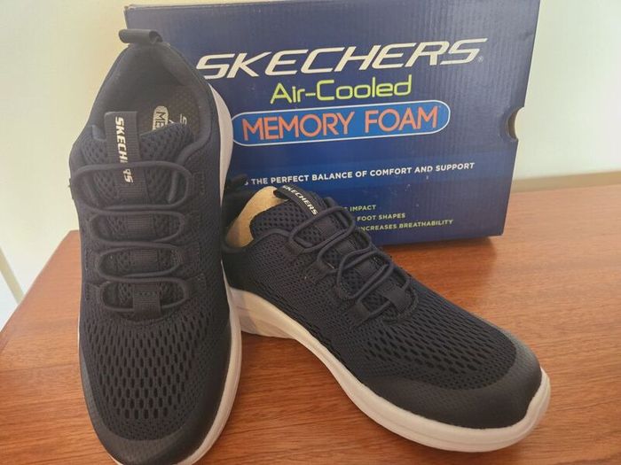 Brand new Navy Skechers shoes
