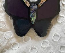 A striking vintage butterfly pendant necklace by Accessorize, featuring iridescent mother of pearl / abalone shell set within black, purple and deep blue resin.
