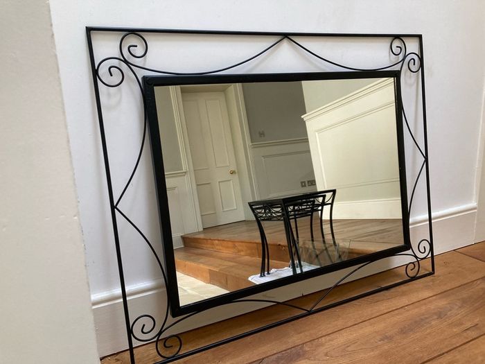 large mirror black cast iron