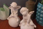 Lovely Vintage Pair of Ceramic Baby Winged Angels Sitting on Globes with a Very Tactile Cream Coloured Crackle Glaze