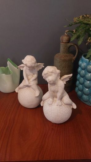 Lovely Vintage Pair of Ceramic Baby Winged Angels Sitting on Globes with a Very Tactile Cream Coloured Crackle Glaze
