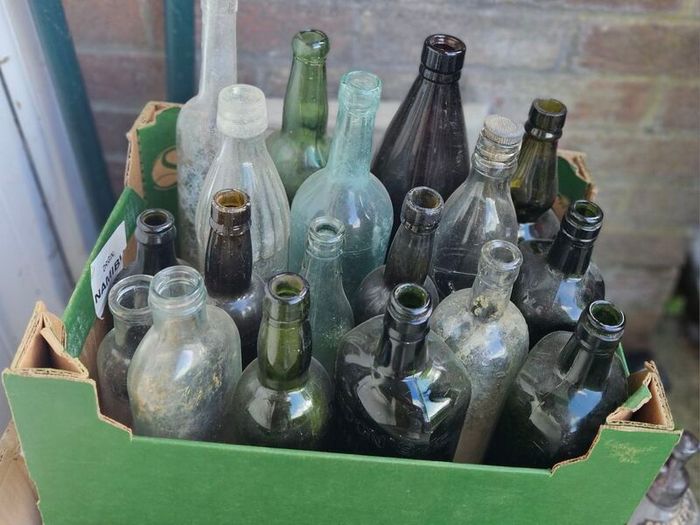 Box of Vintage Bottles and Schweppes Soda Syphon