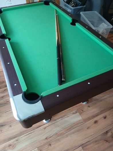 Pool table with cues and balls