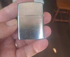 Champ Flip top petrol lighter.