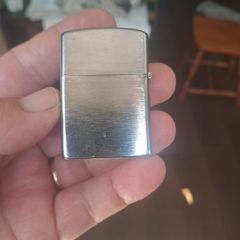 Champ Flip top petrol lighter.