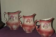 Matching Rockingham Staffordshire pottery pitchers